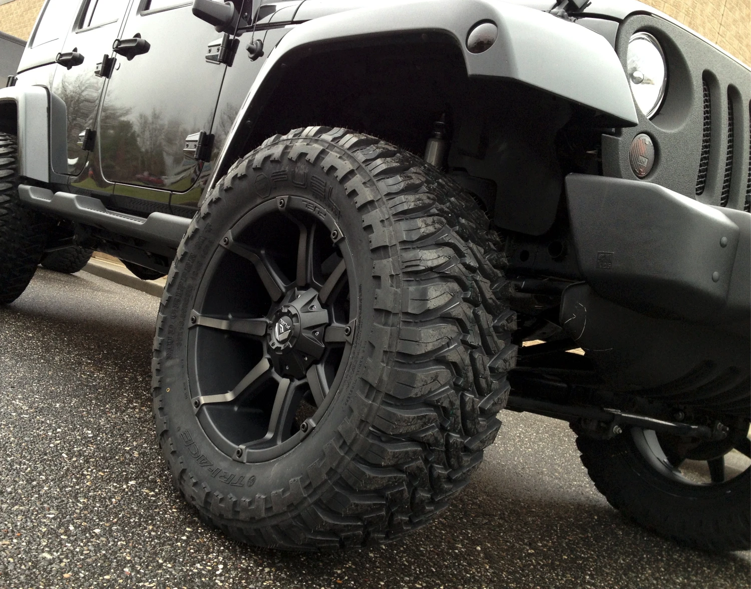 Jeep Wrangler lifted with Wheel Package by Autokicks