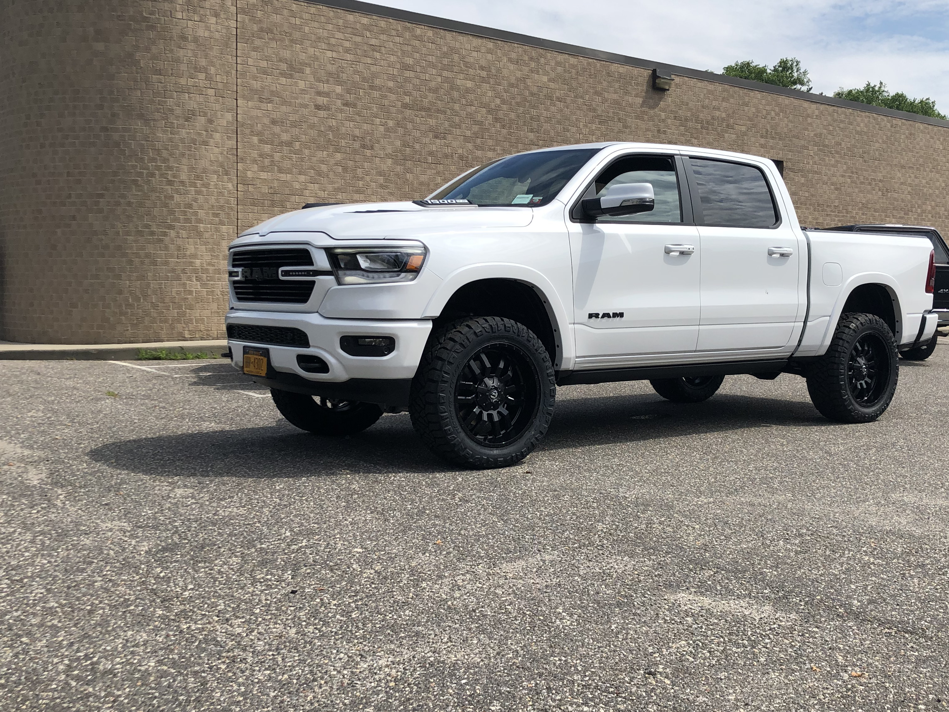 Lift white Ram 1500 by Autokicks