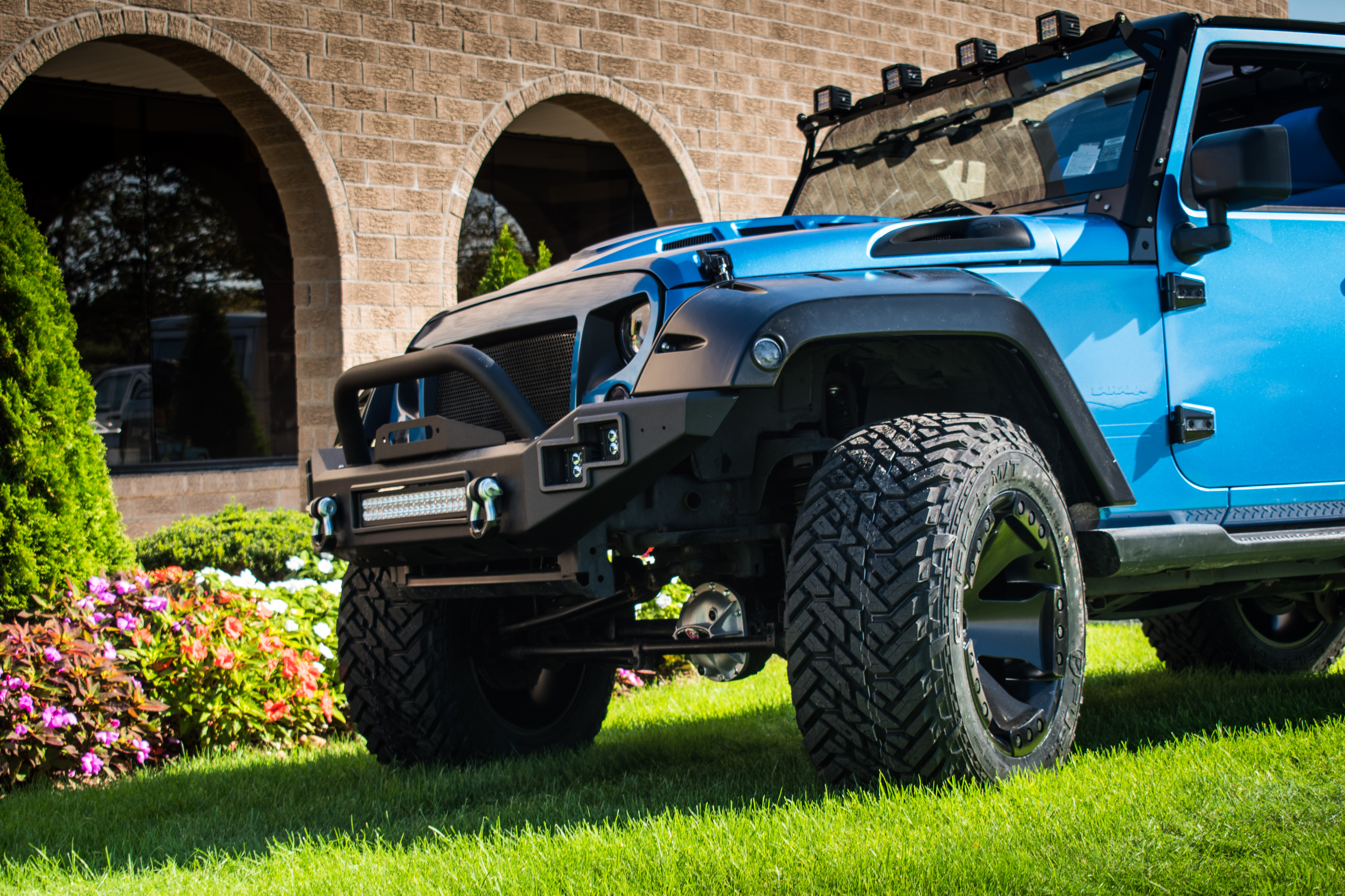 Blue Jeep Wrangler with Fuel Wheels