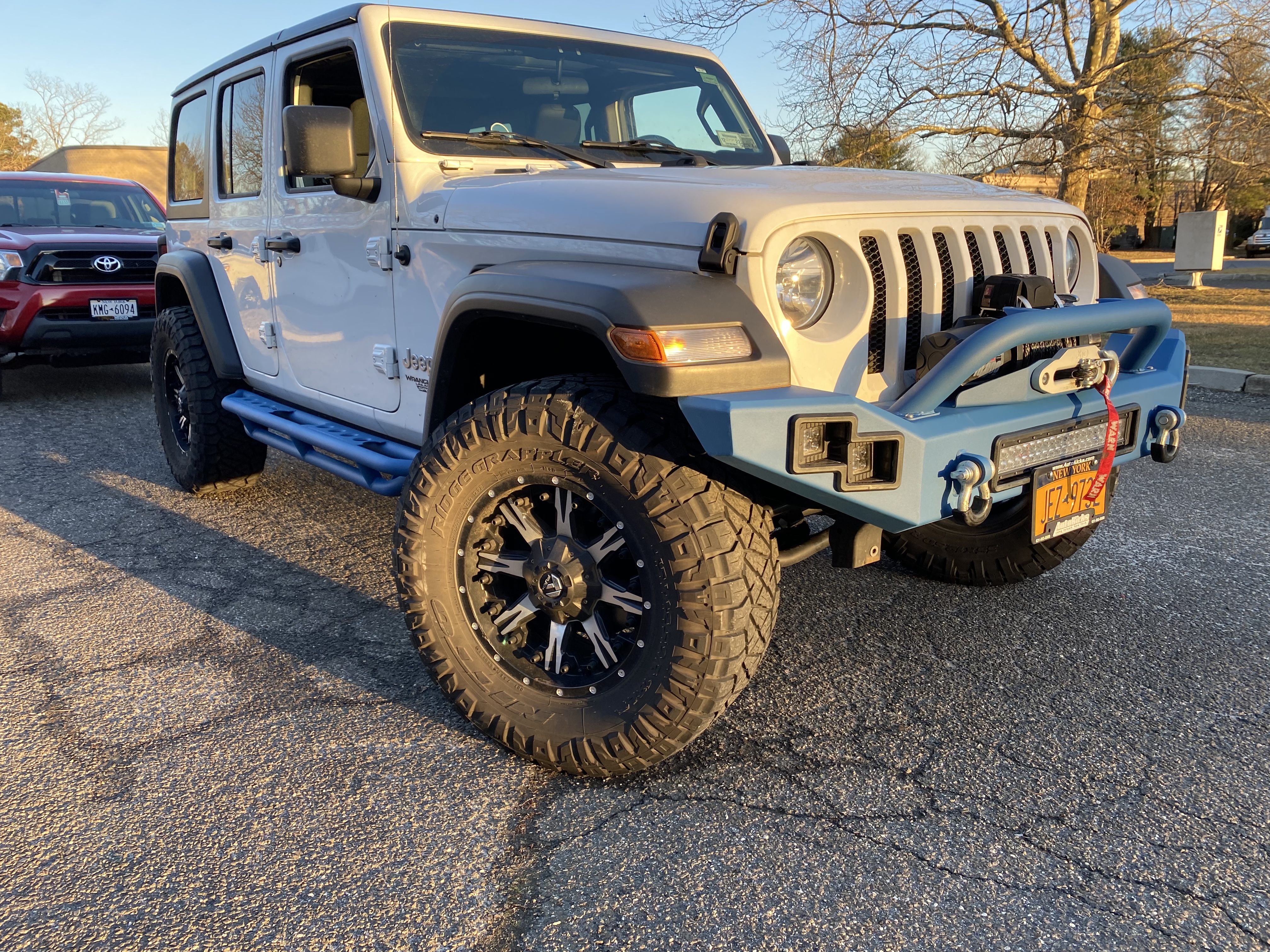 Jeep Wrangler leveled with wheels and tire package by Autokicks