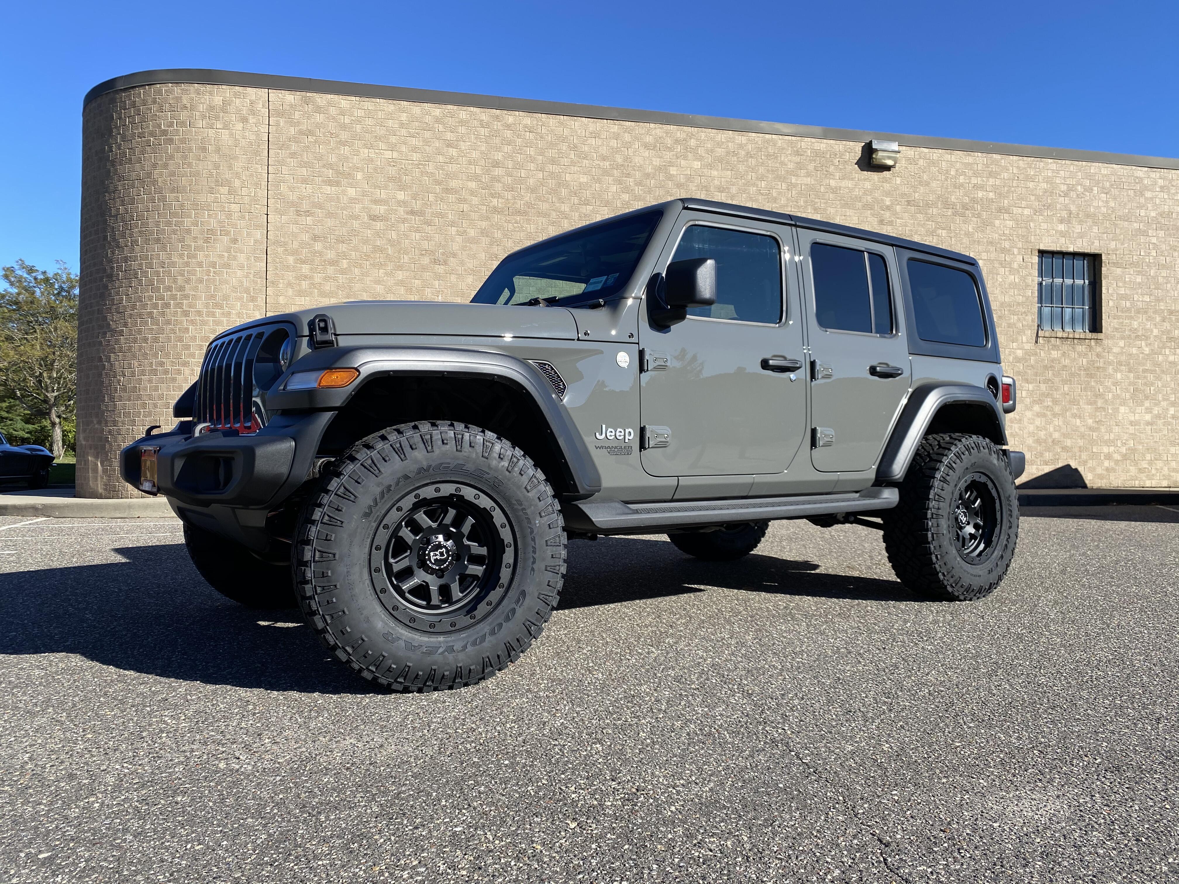 lifted Teal Jeep Wrangler with Black Rhino Wheels